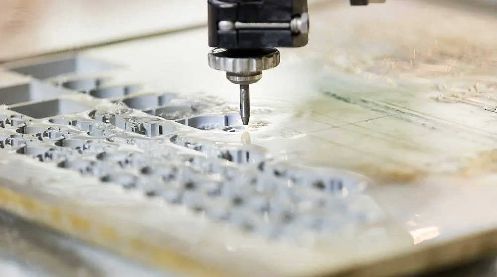 Abrasive jet cutting through metal (Credit: Aumm graphixphoto/Shutterstock)