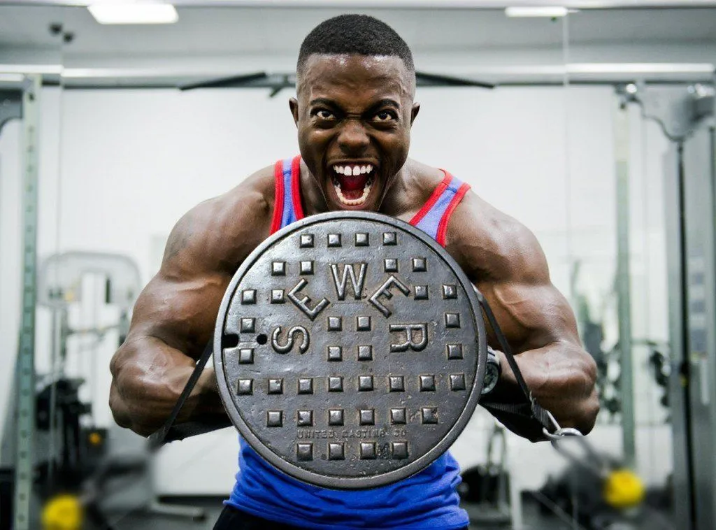 Bodybuilder lifting manhole cover in Stress Meme funny