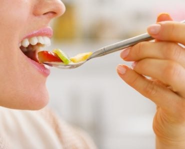 Closeup on woman testing fruits