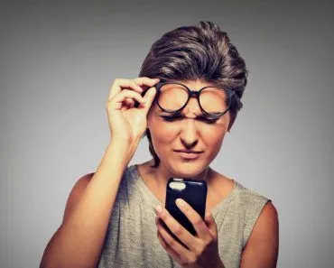 Girl squinting reading eyes