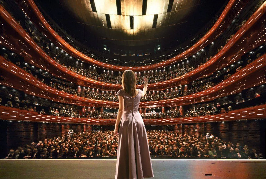 Lady opera singer singing on stage