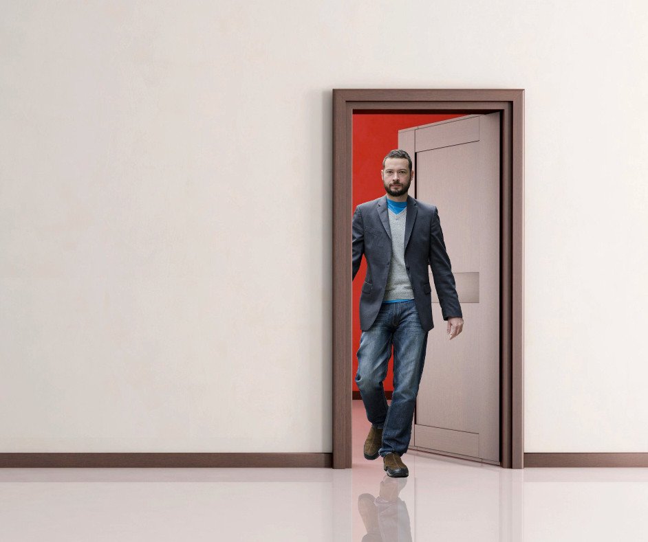Man walking through the doorway
