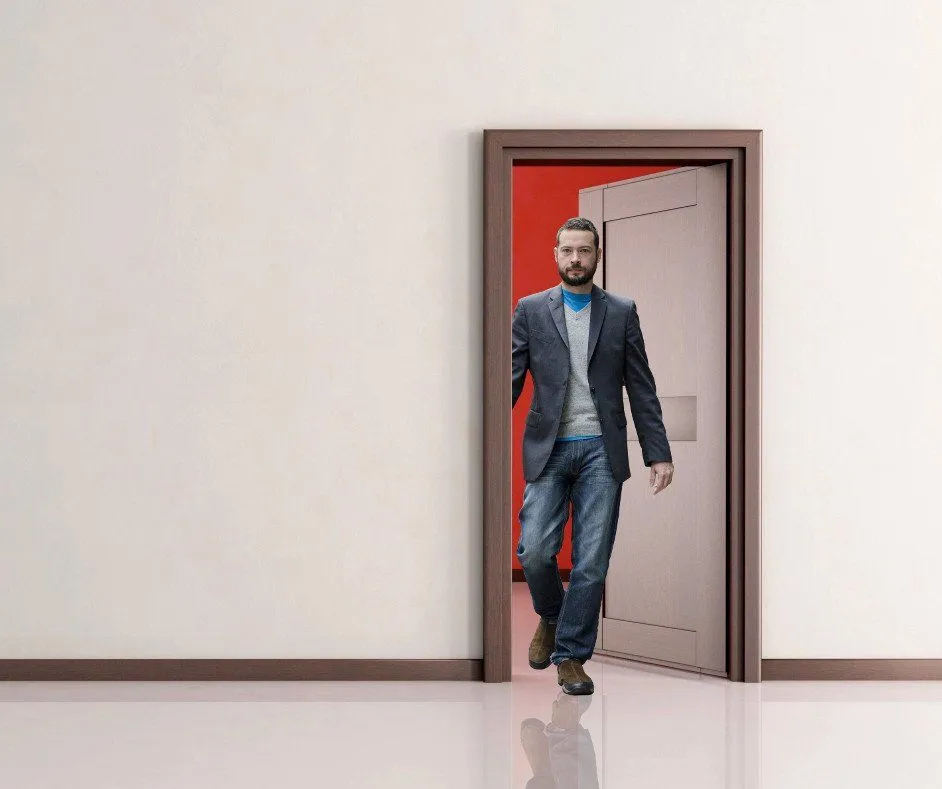 Man walking through the doorway