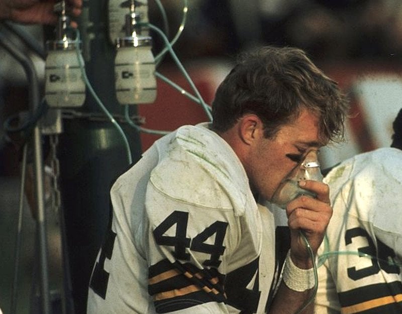 Athlete inhaling football player