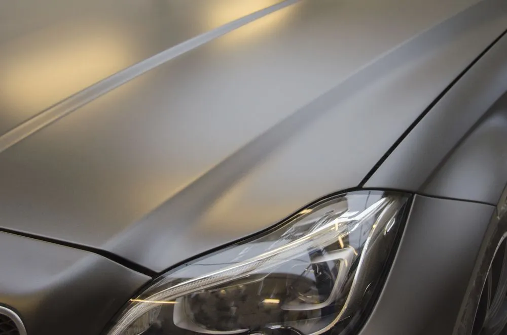 Closeup view of a mate grey luxury car in the car service - Image(Alraun)s