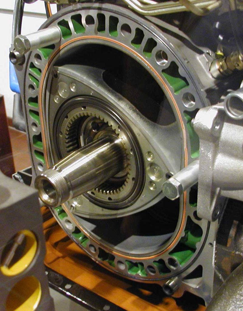 A Wankel engine with its rotor and geared output shaft clearly shown.
