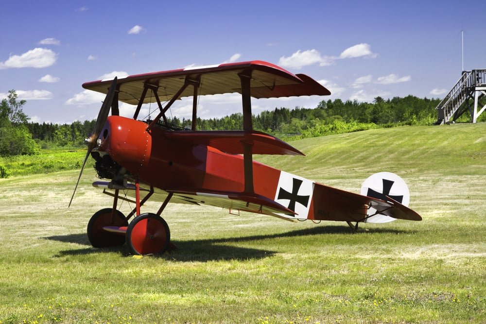 Classic Red Barron Fokker Dr.1 triplane on grass runway. - Image(KWJPHOTOART)s