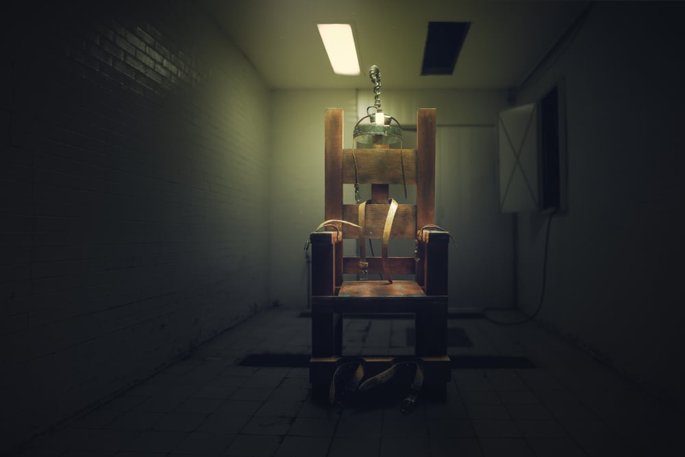 High contrast image of an electric chair on a dark room - Image( Fer Gregory)s