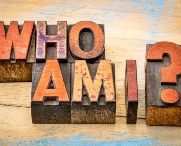Who am I - a philosophical question spelled in vintage letterpress wood type printing blocks against grunge(marekuliasz)s