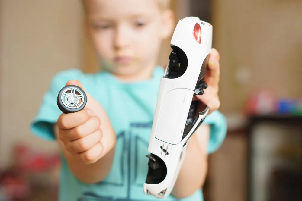 boy broke the toy. broken wheel from the car - Image( Zdan Ivan)S