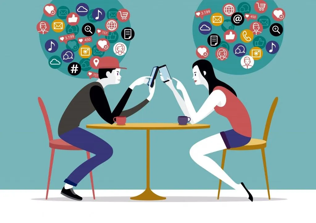 Millennial Couple sitting on a coffee using their smart phones( Jesus Sanz)s
