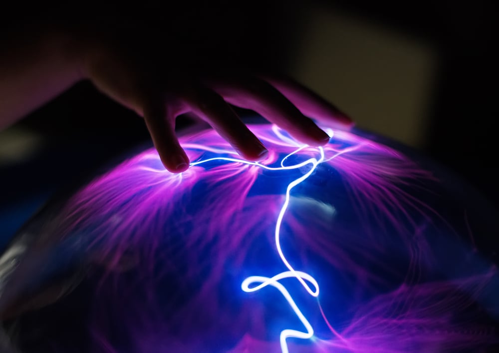 Woman's hand touching plasma globe(Dmitri Ma)s