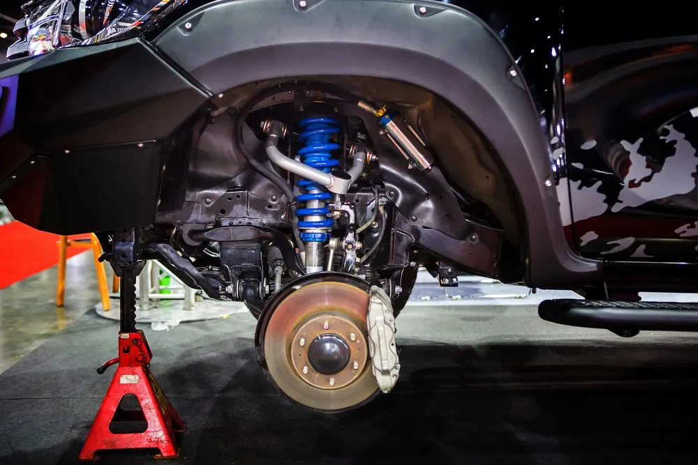 Race car disc brake and blue shock absorber( Nixx Photography)S