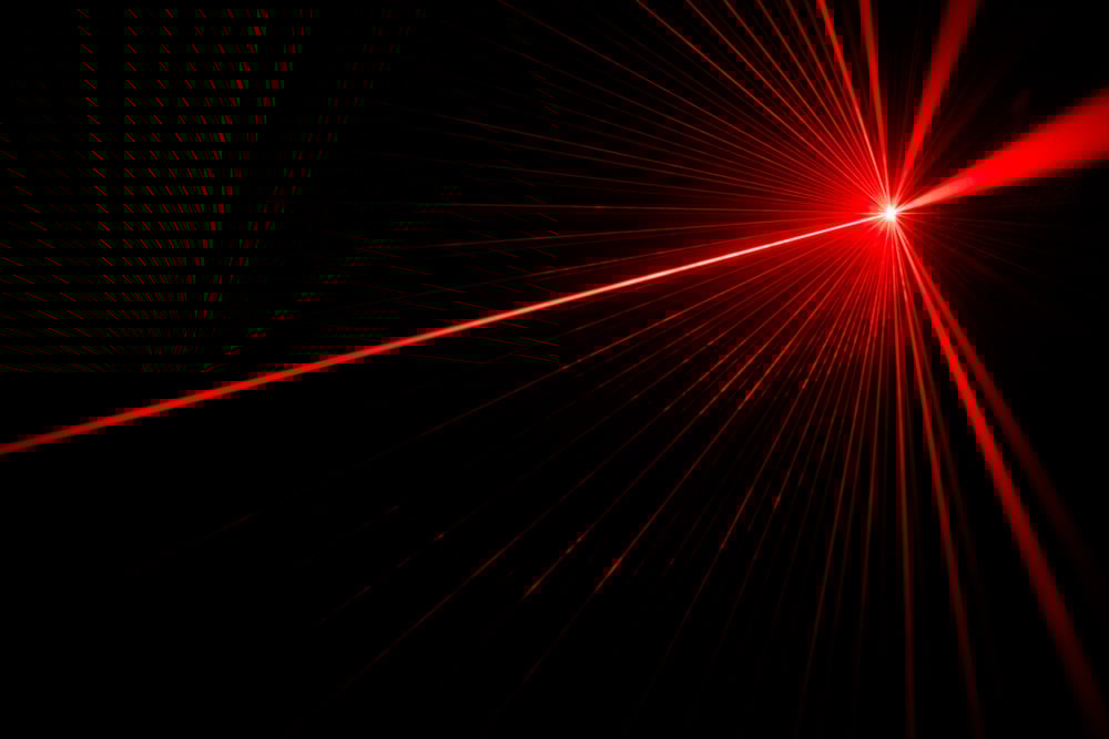 Red laser beam light effect on black background(donatas1205)s