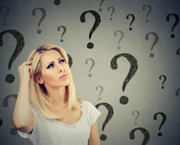 Portrait confused thinking woman bewildered scratching head seeks a solution looking up at many question marks(pathdoc)S