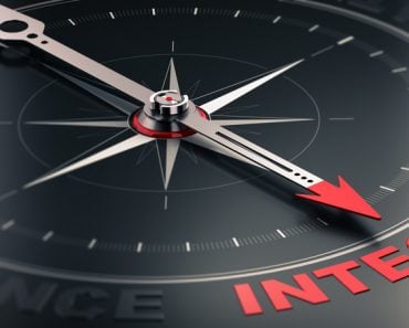 compass over black background with needle pointing the word integrity(Olivier Le Moal)s