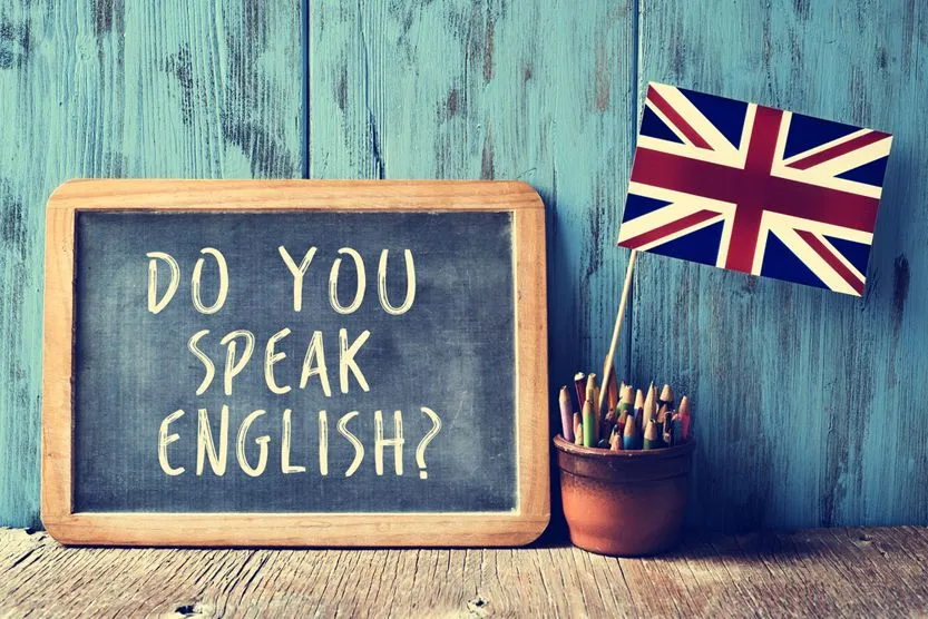 a chalkboard with the text do you speak english(nito)S