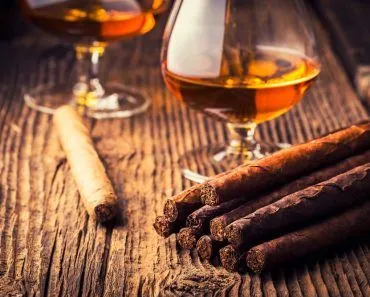 quality cigars and cognac on an old wooden table(Adrian_am13)s
