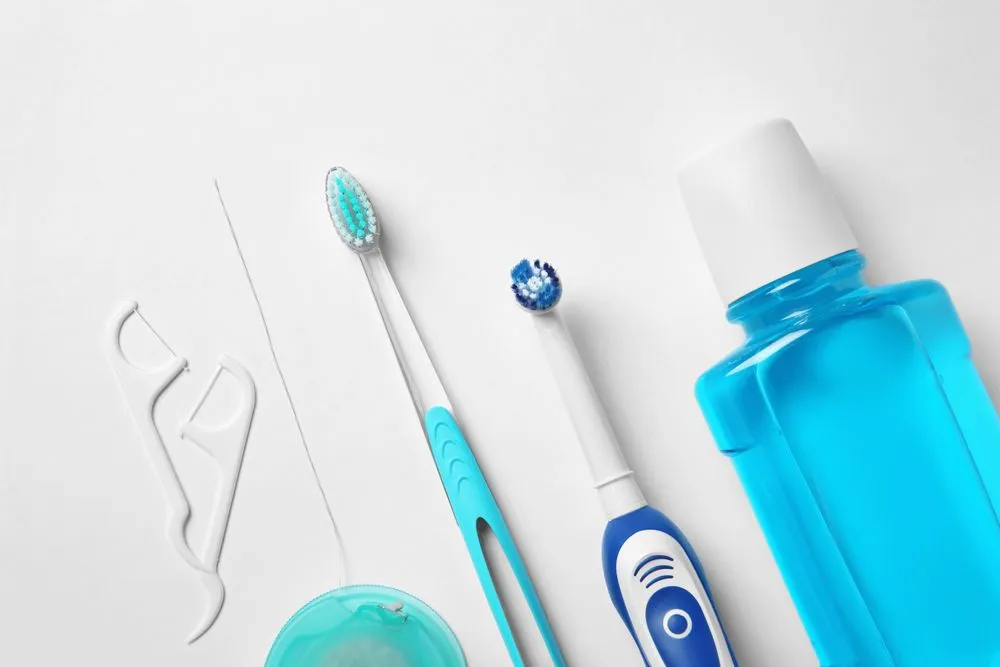 Flat lay composition with toothbrushes and oral hygiene products(New Africa)s