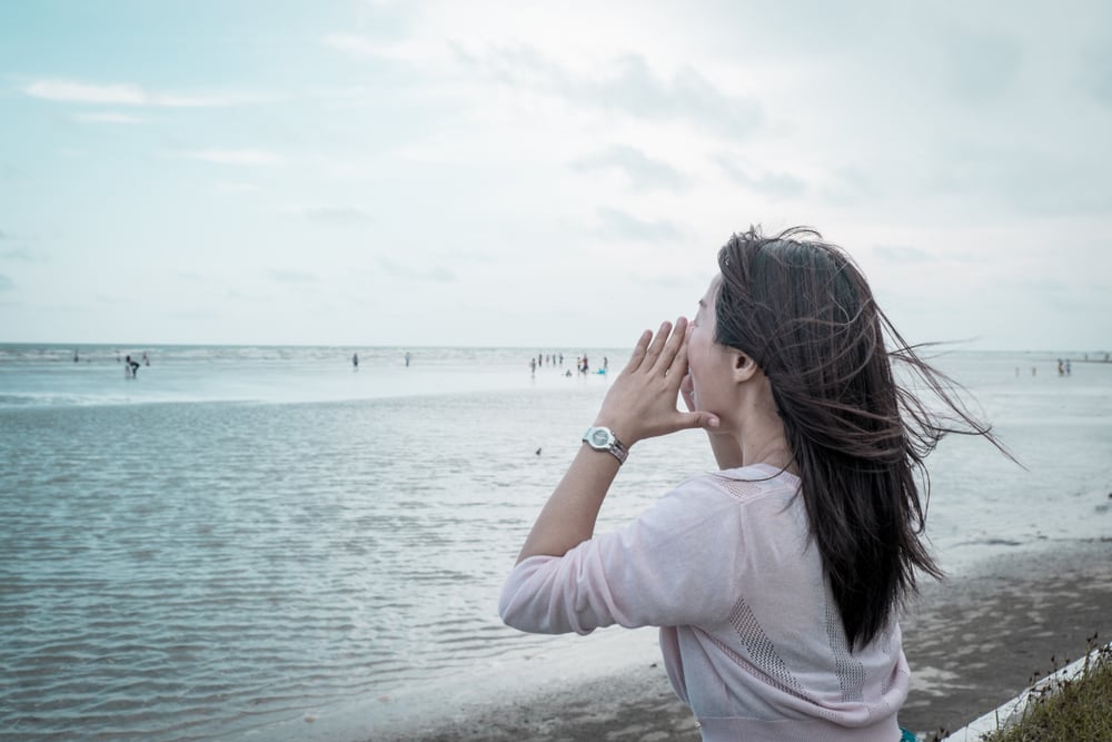 shouting on the shore feeling relax and free with the wind from the sea(mantinov)s