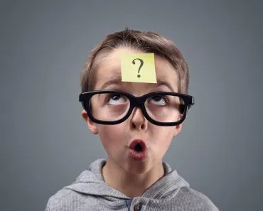 Confused boy thinking with question mark on sticky note on forehead(Brian A Jackson)s