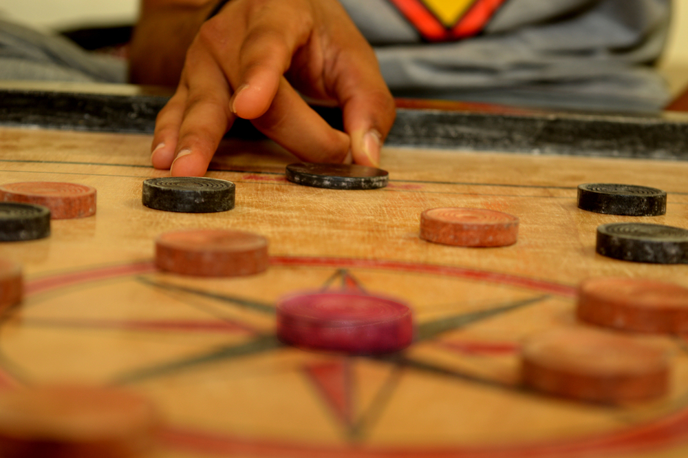 play carrom board game(Mr. Sagar)s