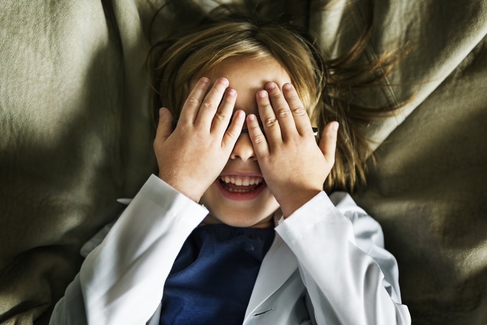 Cute girl playing peekaboo