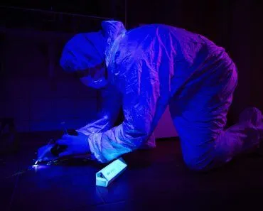 Ultra,Violet,Light,Helping,To,Collect,Evidences,On,Place,Of