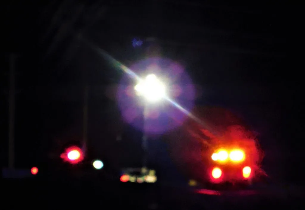 law-enforcement-a-law-enforcement-vehicle-with-the-red-lights-blaring-on-top-has-stopped-a-vehicle_t20_8lZ8Zj