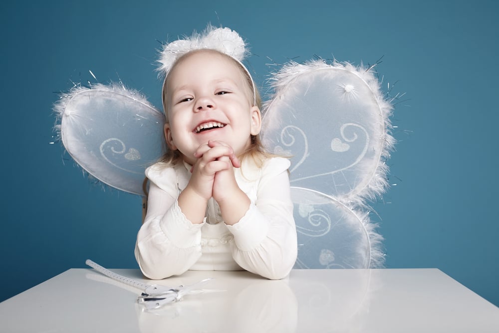Cute,Little,Girl,With,Butterfly,Costume,On,Blue,Background