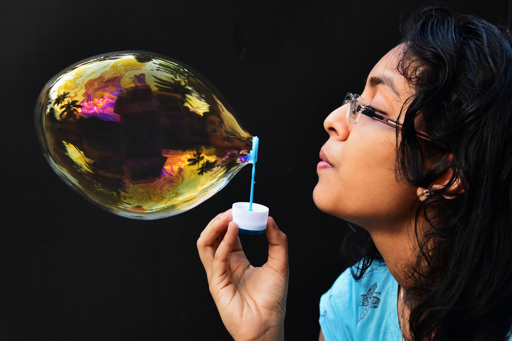Thin,Film,Interference.,Teenage,Girl,Blowing,A,Big,Colorful,Soap