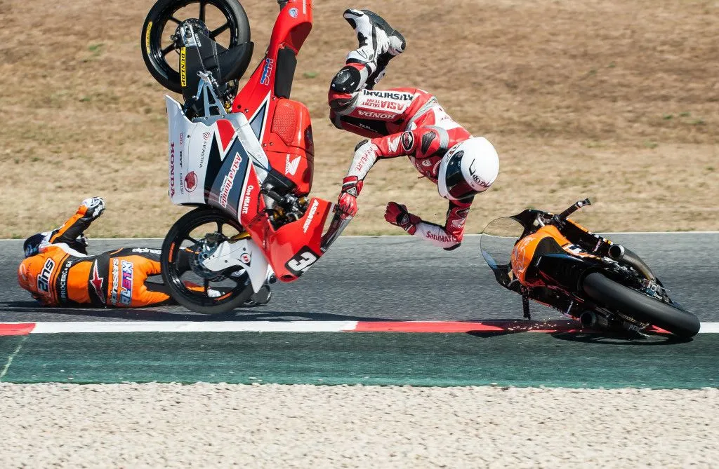 BARCELONA, SPAIN JUNE 18, 2017 Crash during Moto 3 race at FIM CEV Repsol that celebrates at Circuit of Barcelona Catalunya.