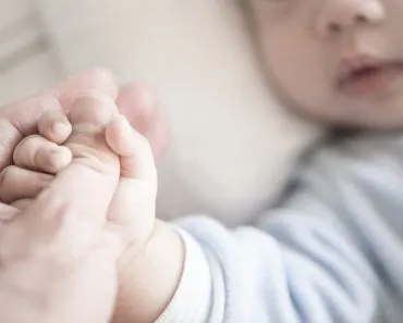 Little,Newborn,Baby,Holding,Parent's,One,Hand,,Close-up,Macro,Shot.