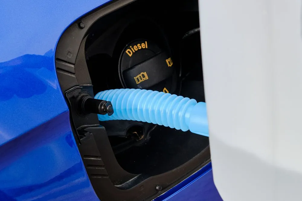 Close,Up,Filling,Of,Diesel,Exhaust,Fluid,From,Canister,Into
