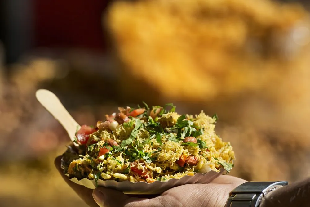 Man,Holding,Bhelpuri,Plate