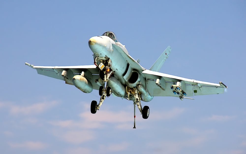 An,F-18,Hornet,Prepares,To,Land,Aboard,An,Aircraft,Carrier