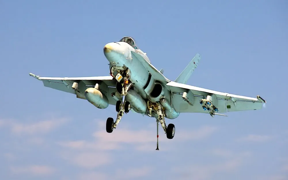 An,F-18,Hornet,Prepares,To,Land,Aboard,An,Aircraft,Carrier