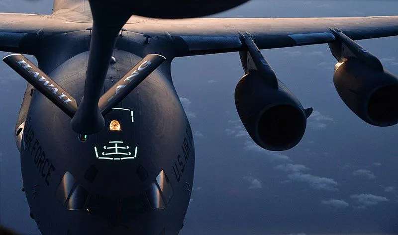 A C-17 Globemaster III is guided into position behind the boom of a KC-135 Stratotanker during an in-air refueling training mission March 20, 2014, near Joint Base Pearl Harbor-Hickam, Hawaii. The boom was guided by Airman 1st Class Rebekah McCormack, a 96th Air Refueling Squadron in-flight refueling specialist, during refueling procedures training. (U.S. Air Force photo/Staff Sgt. Alexander Martinez)