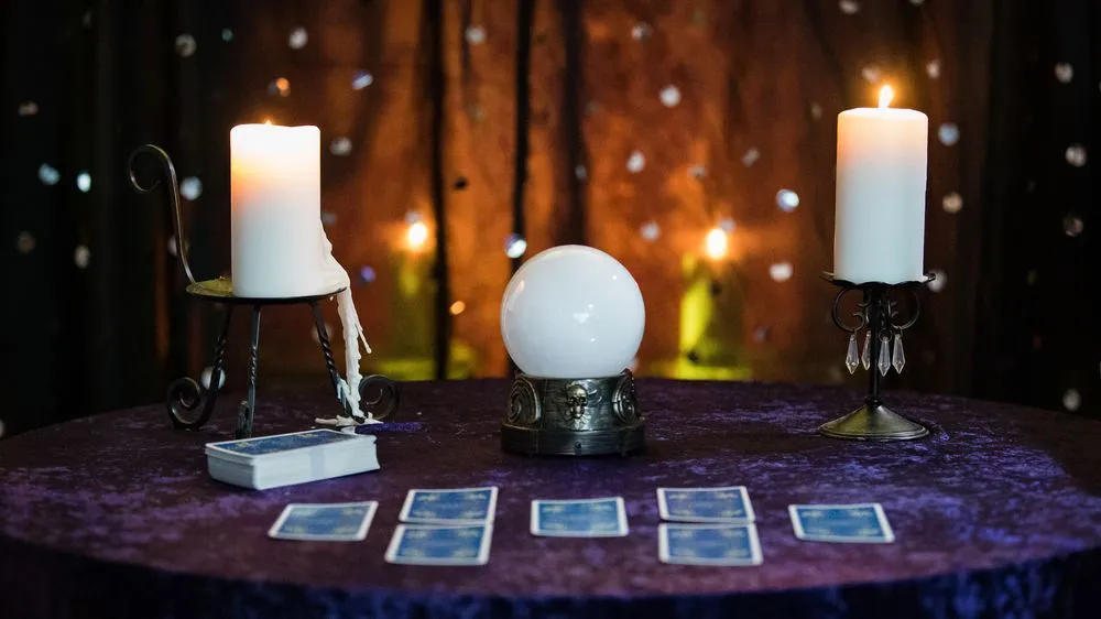 Fortune Telling Table with a crystal ball and tarot cards