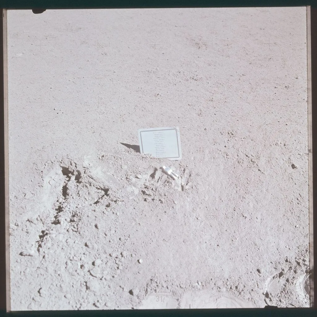 Fallen Astronaut Sculpture along with the plaque on the moon