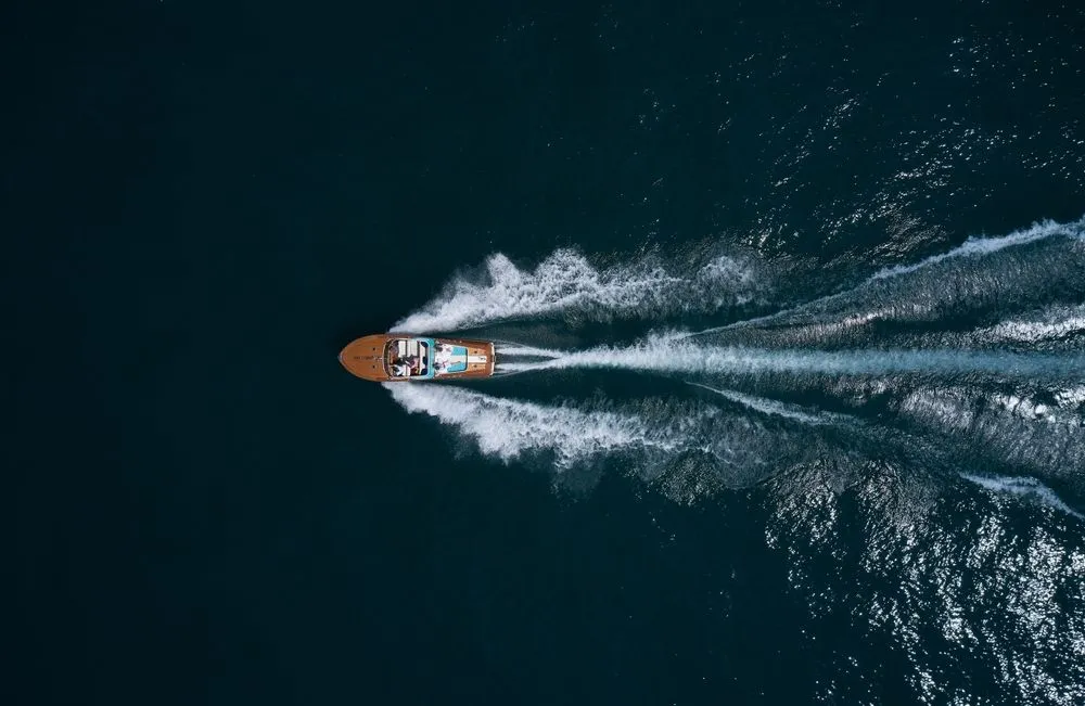 Modern,Wooden,Boat,In,A,Classic,Design,,Moving,On,Water,