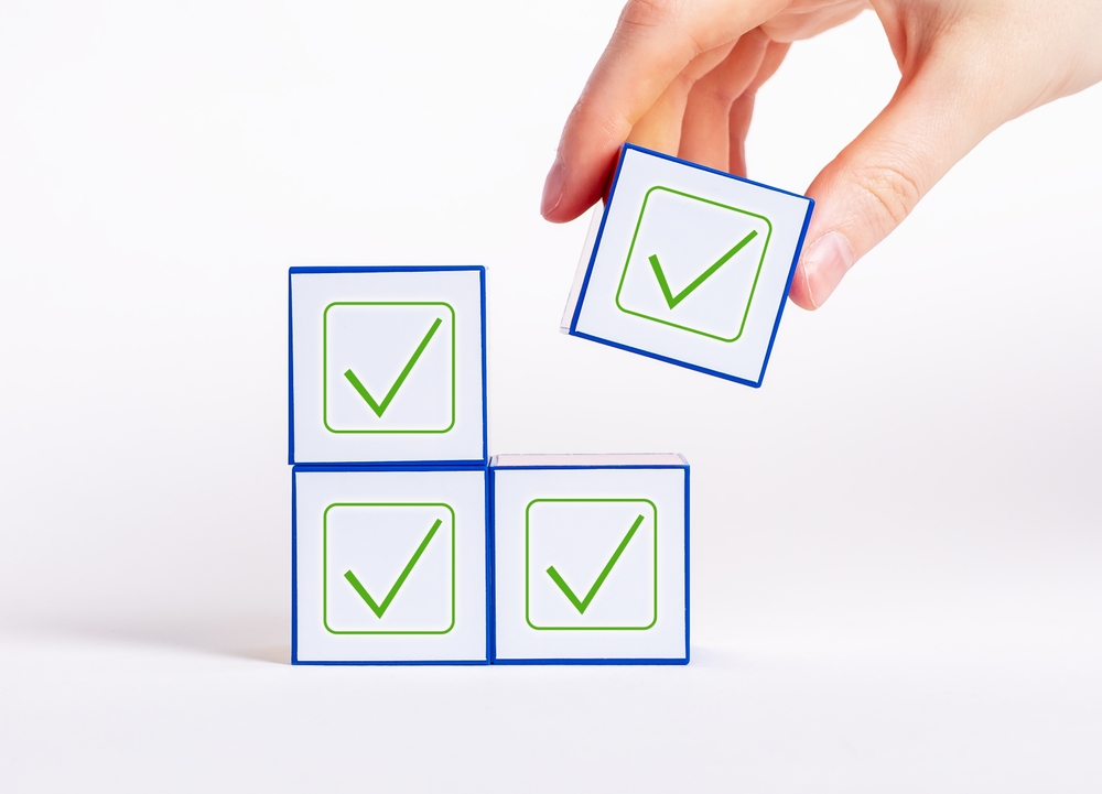 Affirmative,Unanimous,Decisions,Making.,Hand,Holding,Cube,With,Check,Mark.