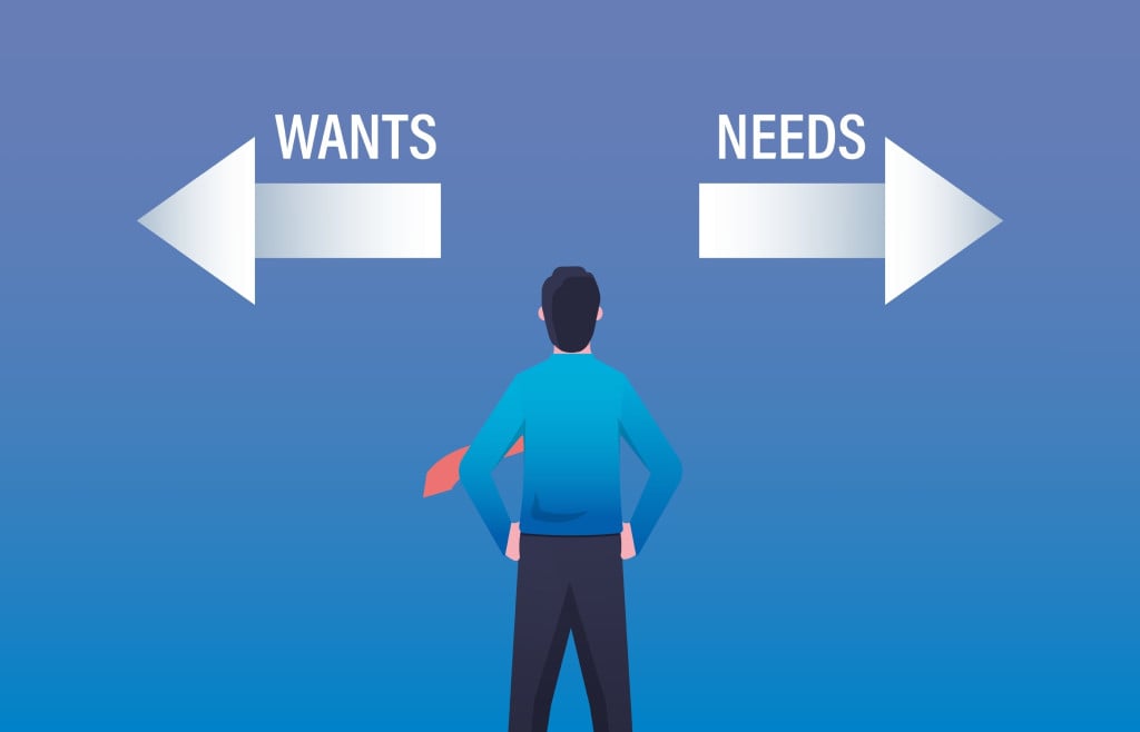 Businessman dilemma choice between wants and needs