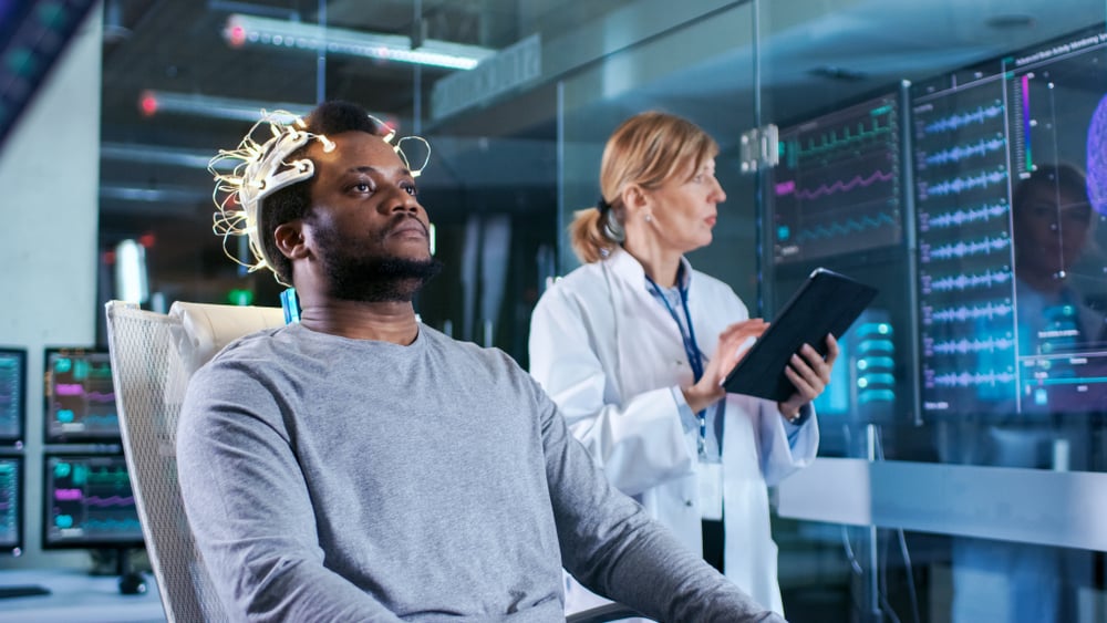 In,Laboratory,Man,Wearing,Brainwave,Scanning,Headset,Sits,In,A