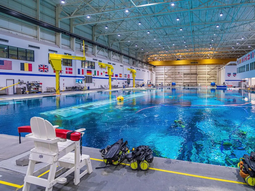 This is a photograph of the pool at the Neutral Buoyancy Laboratory in Houston, Texas. (Credits: Framalicious/Shutterstock)