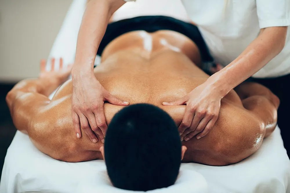 Image displaying an individual receiving a massage (Credits: microgen/Envato Elements)