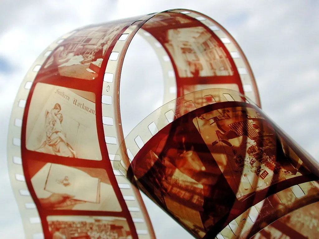 A reel from 1969 shows how movies were stored as a series of images on a filmstrip. These are basically colored sheets that are run in a sequence to give the impression of motion. (Credits: Bart Everson/Wikimedia Commons)