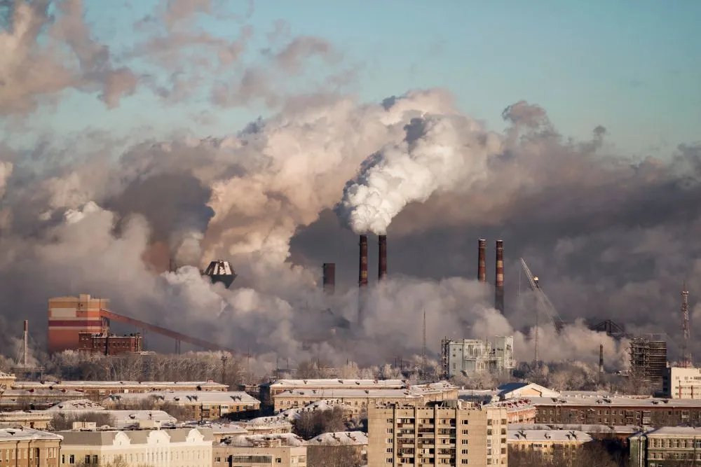 Some industries are located at the outskirts of cities and towns due to their emissions. Emission release is a negative externality for the people living in the surrounding areas. (Credits: angel-nt-111/Freepik)