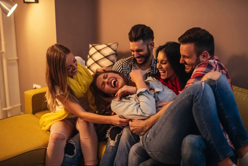 Laughter is highly dynamic and engages your body systems to an extent where you can barely manage to sit straight. (Credits: bbernard/Shutterstock)