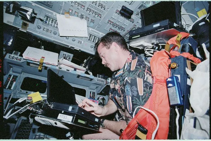 Astronaut Chris Hadfield using a computer while aboard the International Space Station. (Credits: The U.S. National Archives)